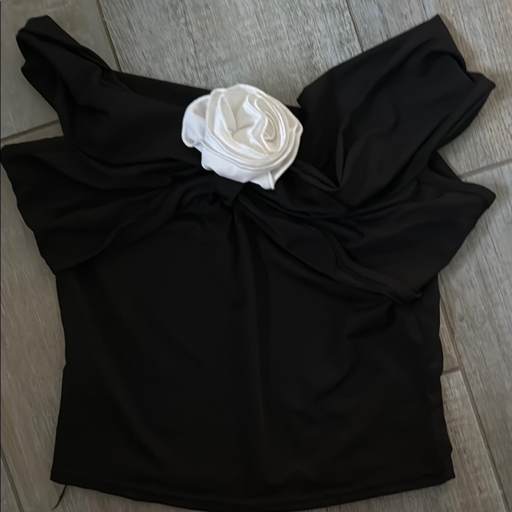 Elegant Black Top with White Floral Accent